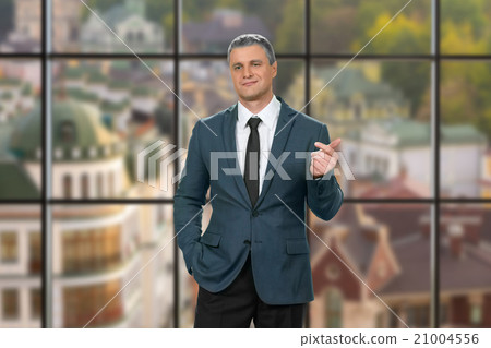 Cynical adult businessman at workplace.  21004556