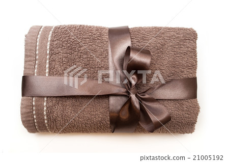 brown towel tied with a ribbon and bow brown towel tied with a ribbon and bow 21005192