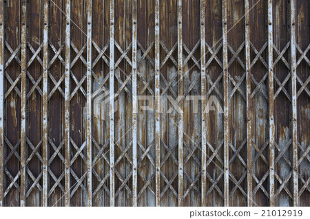 rusty old iron door of abandoned house and deteriorate. rusty old iron door of abandoned house and deteriorate. 21012919