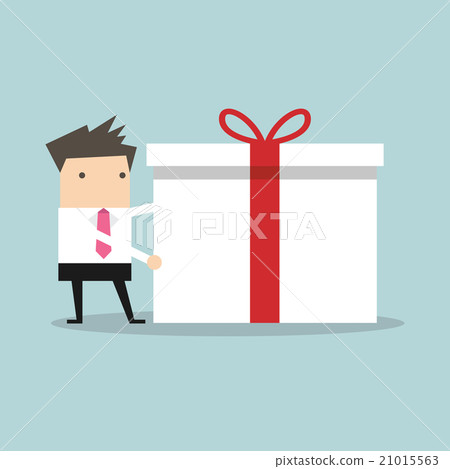 Businessman holding a big gift box for Christmas Businessman holding a big gift box for Christmas 21015563