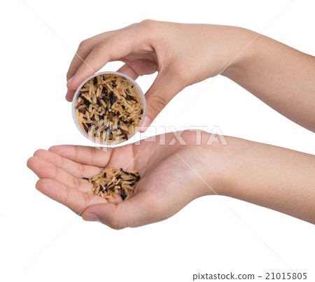 cup of brown rice grain in hands cup of brown rice grain in hands 21015805
