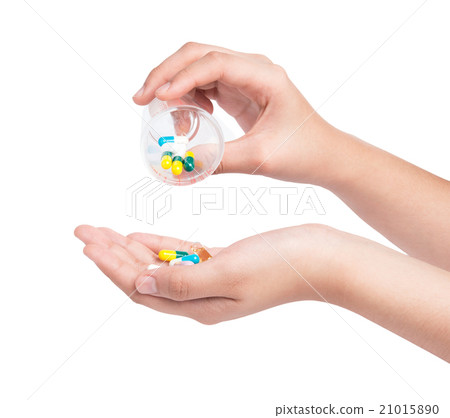 Druge capsules and pills in hand Druge capsules and pills in hand 21015890