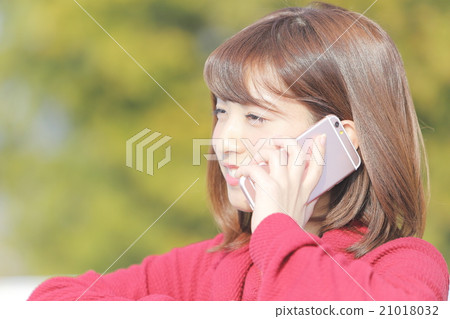 A young woman talking outdoors A young woman talking outdoors 21018032