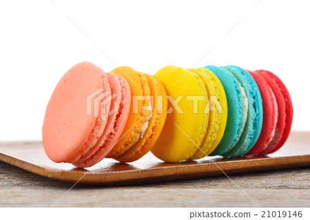 close up of colorful macarons on white background 21019146