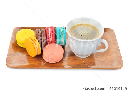 close up of colorful macarons and cup of coffee 21019149