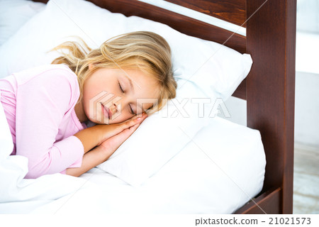 Little girl sleeping on white bed Little girl sleeping on white bed 21021573