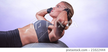 Composite image of muscular woman doing sit ups 21022444