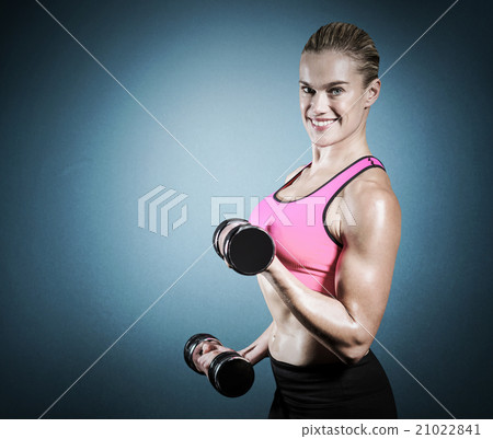 Composite image of muscular woman lifting heavy dumbbells 21022841