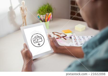Composite image of photo editor using tablet pc Composite image of photo editor using tablet pc 21022898