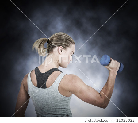 Composite image of muscular woman working out with dumbbells Composite image of muscular woman working out with dumbbells 21023022