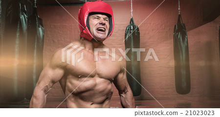 Composite image of angry boxer with headgear Composite image of angry boxer with headgear 21023023