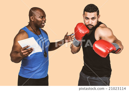 Composite image of boxing coach with his fighter 21023114