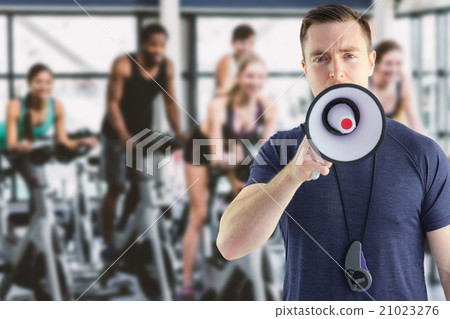 Composite image of male trainer yelling through the megaphone Composite image of male trainer yelling through the megaphone 21023276