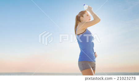 Composite image of fit woman with water Composite image of fit woman with water 21023278