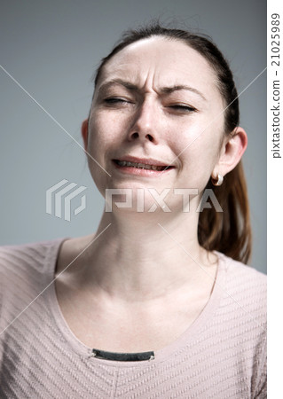 The crying woman with tears on face closeup 21025989