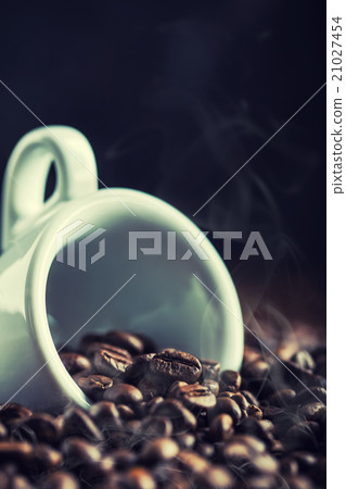 Coffee beans. Coffee cup full of coffee beans. Coffee beans. Coffee cup full of coffee beans. 21027454