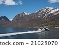 Passanger boat floating in Norwegian fjords 21028070
