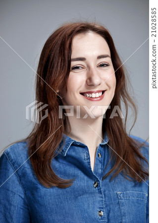The happy woman on gray background The happy woman on gray background 21028585
