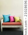 Colorful 3 pillows on a white chair 21028696
