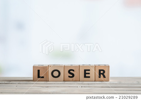 Loser sign on a wooden desk Loser sign on a wooden desk 21029289