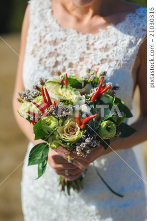 Bouquet in hands of bride Bouquet in hands of bride 21030316