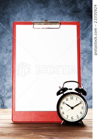 Blank paper sheet and alarm clock Blank paper sheet and alarm clock 21030924