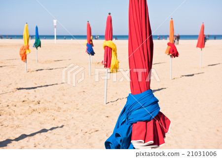The famous colorful parasols on Deauville beach The famous colorful parasols on Deauville beach 21031006
