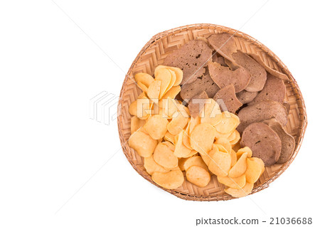 Dried raw prawn and fish crackers on rattan tray Dried raw prawn and fish crackers on rattan tray 21036688