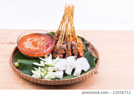 Barbecue satay served on traditional rattan plate Barbecue satay served on traditional rattan plate 21036712