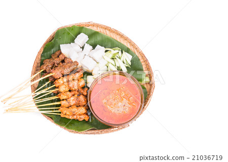 Barbecue satay served on traditional rattan plate Barbecue satay served on traditional rattan plate 21036719