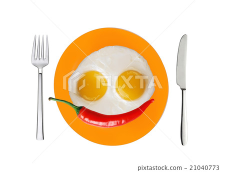 two fried eggs and red hot chilly pepper on plate two fried eggs and red hot chilly pepper on plate 21040773