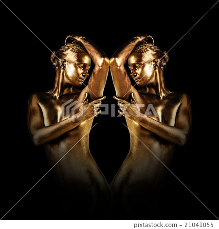 Young woman with golden skin  21041055