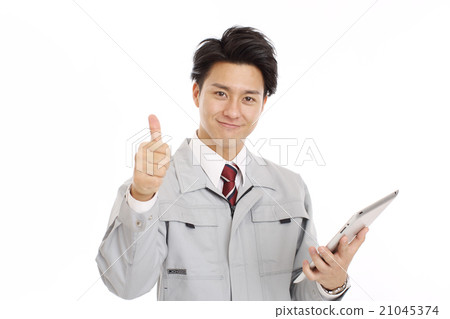 A man looking at a tablet in uniform 21045374