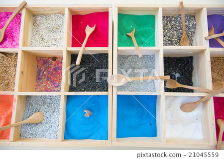 colorful sands and colorful rocks in wooden box colorful sands and colorful rocks in wooden box 21045559
