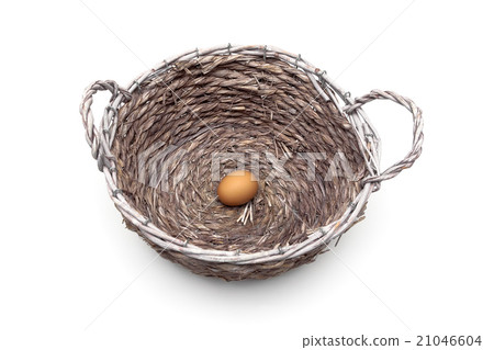 egg lies in a large basket on a white background 21046604
