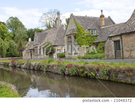 English stone cottage traditional village river  21048372