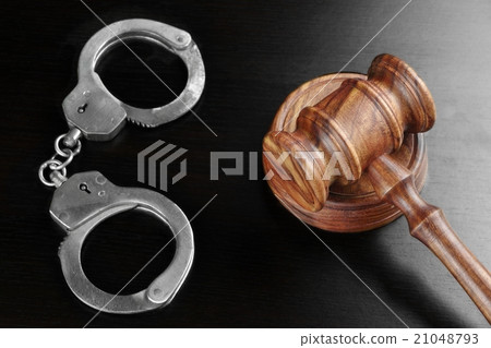 Real Judges Gavel And Handcuffs On The Black Table Real Judges Gavel And Handcuffs On The Black Table 21048793