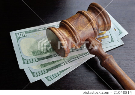 Judges Gavel And Dollar Cash  On The Black Table 21048814