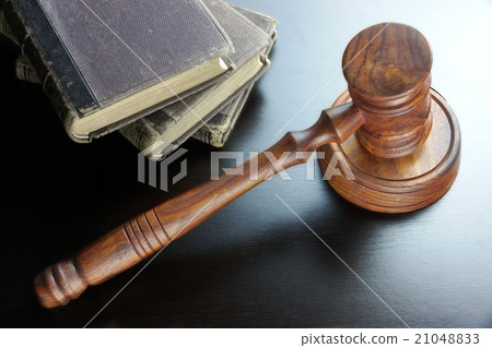 Judges Gavel And Old Book On The Wooden Table Judges Gavel And Old Book On The Wooden Table 21048833