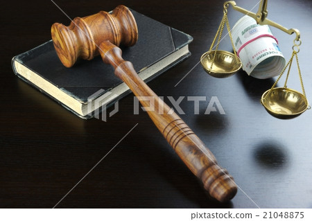 Judges Gavel,  Scale, Old Book And Cash On Table 21048875