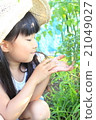 A girl playing a home garden 21049027