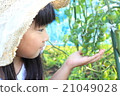 A girl playing a home garden 21049028