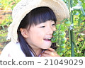 A girl playing a home garden 21049029
