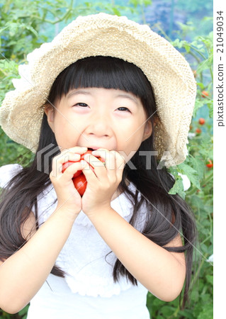 A girl playing a home garden A girl playing a home garden 21049034
