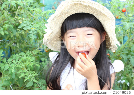A girl playing a home garden A girl playing a home garden 21049036