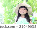 A girl playing a home garden 21049038
