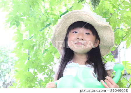 A girl playing a home garden A girl playing a home garden 21049038