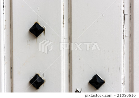 window with closed white wooden shutters window with closed white wooden shutters 21050610