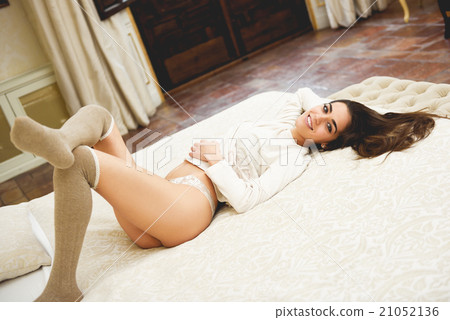 Sexy young woman in lingerie posing on the bed 21052136