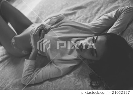 Sexy young woman in lingerie posing on the bed 21052137